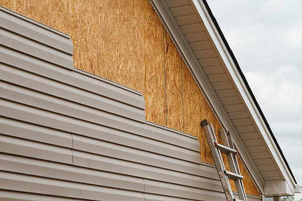 Professional Siding technician working in Starford, PA